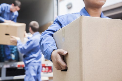 Office removals team planning a Chelsea business relocation with boxes and desks