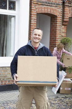 Removal team planning a house move in a Chelsea street