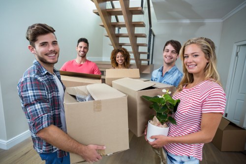 Packed boxes and careful furniture handling during a local house move