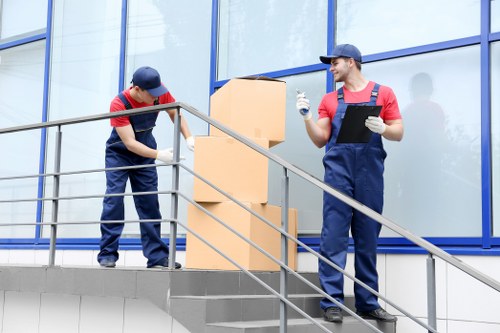 Local moving team handling boxes and household items in Chelsea