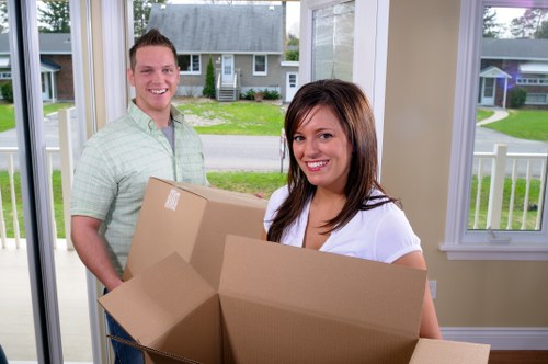 Movers handling items carefully in a Chelsea apartment building