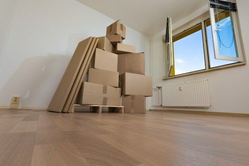 Professional movers transporting business furniture in Chelsea