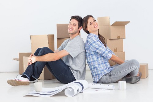 Movers handling furniture removal in a Chelsea townhouse setting