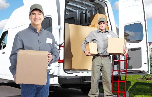 Packed boxes and furniture prepared for a home move in Chelsea