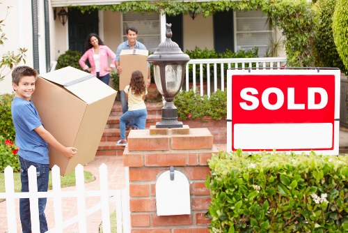 Moving crew applying careful protection practices at a Chelsea property
